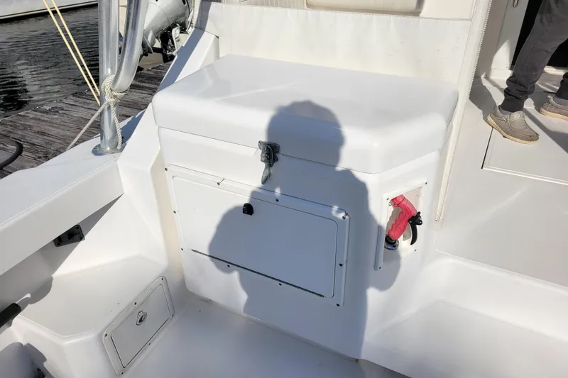 Slide: The Image of 1998 Cabo 31 Express boat deck with storage compartment and shadow. - 34