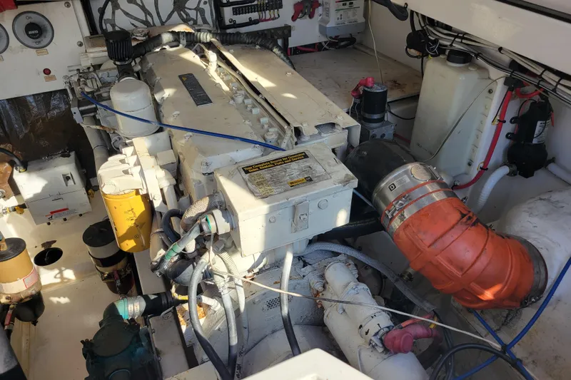 Slide: The Image of Engine room of 1998 Cabo 31 Express with Tower, showcasing mechanical components and wiring. - 39