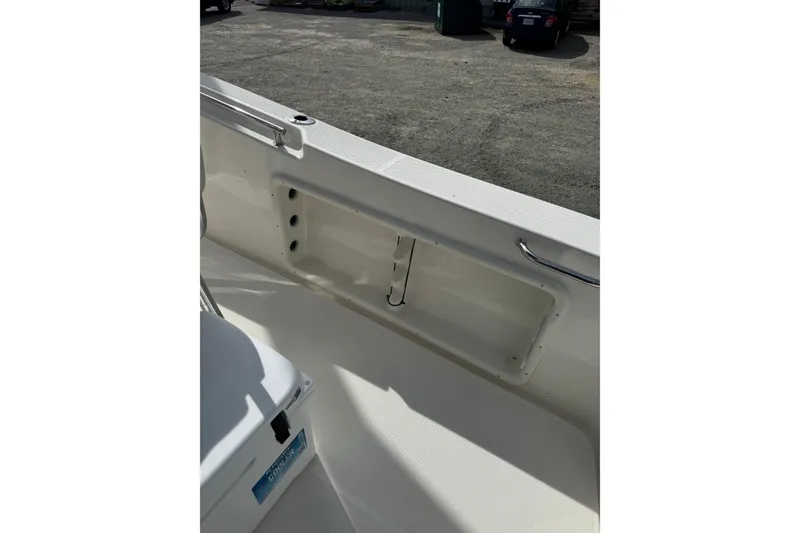 Slide: The Image of Interior view of a 2026 Bulls Bay 230 CC boat, showcasing storage compartment. - 2