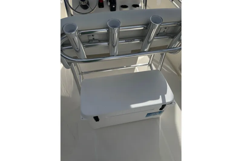 Slide: The Image of 2026 Bulls Bay 230 CC boat console with rod holders and cooler. - 3
