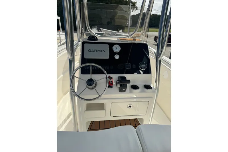 Slide: The Image of 2026 Bulls Bay 230 CC boat console with Garmin navigation system and steering wheel. - 4