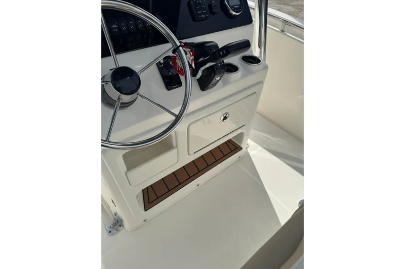 Slide: The Image of 2026 Bulls Bay 230 CC boat console with steering wheel and controls. - 5