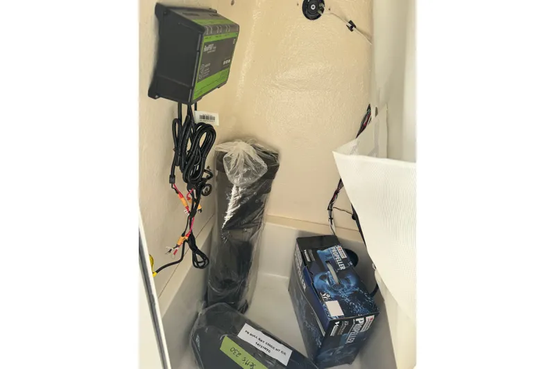 Slide: The Image of Interior of 2026 Bulls Bay 230 CC boat showing wiring and equipment storage. - 6