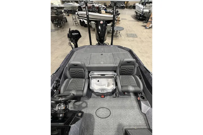 Slide: The Image of 2026 Vexus boat interior with dual seats and steering wheel in showroom. - 12