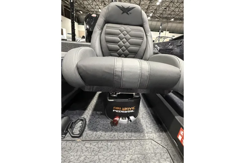 Slide: The Image of 2026 Vexus boat seat with Air Wave pedestal in a modern interior setting. - 13