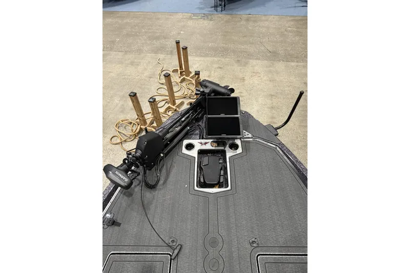 Slide: The Image of 2026 Vexus boat deck with Garmin electronics and trolling motor setup. - 16