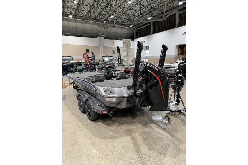 Slide: The Image of 2026 Vexus boat displayed indoors, featuring a powerful outboard motor and sleek design. - 5