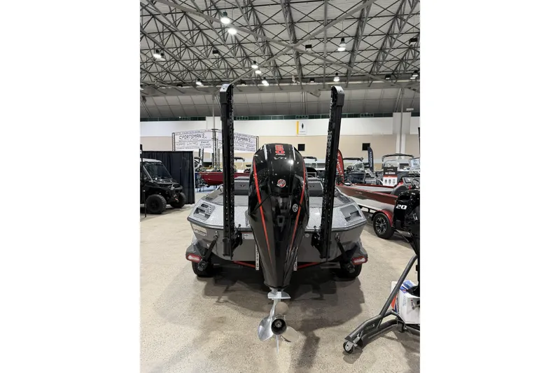 Slide: The Image of 2026 Vexus boat with powerful outboard motor displayed at an indoor exhibition. - 6