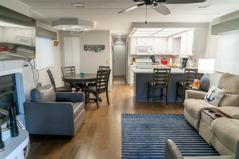 Slide: The Image of Interior of 1996 Lakeview 66 x 16 Widebody Houseboat with modern furnishings and kitchen. - 20