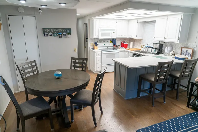 Slide: The Image of Interior of 1996 Lakeview houseboat with modern kitchen and dining area. - 23