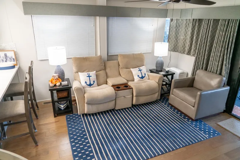 Slide: The Image of Cozy living area in 1996 Lakeview houseboat with nautical decor and comfortable seating. - 29