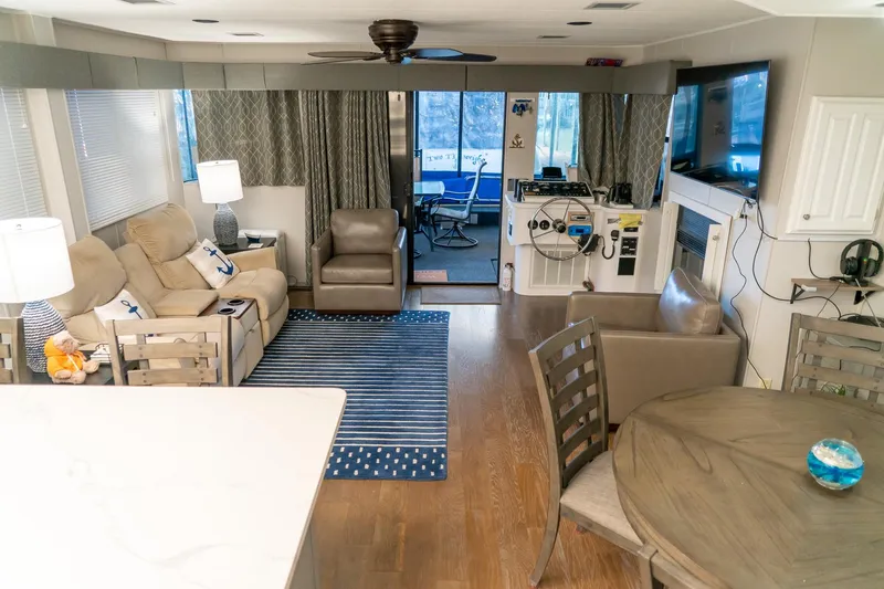 Slide: The Image of Spacious interior of 1996 Lakeview 66 x 16 Widebody Houseboat with modern furnishings. - 32