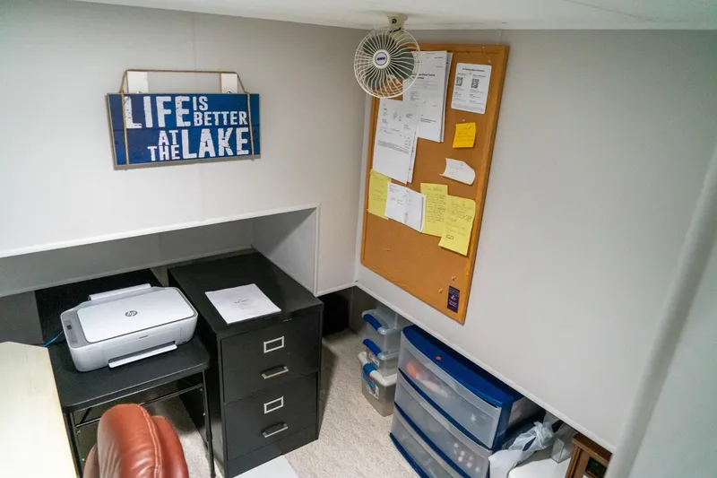 Slide: The Image of Office space on 1996 Lakeview houseboat with desk, printer, and bulletin board. - 55