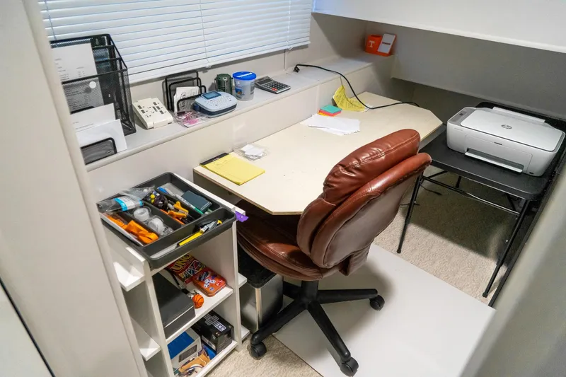Slide: The Image of Office space on 1996 Lakeview houseboat with desk, chair, and printer setup. - 56