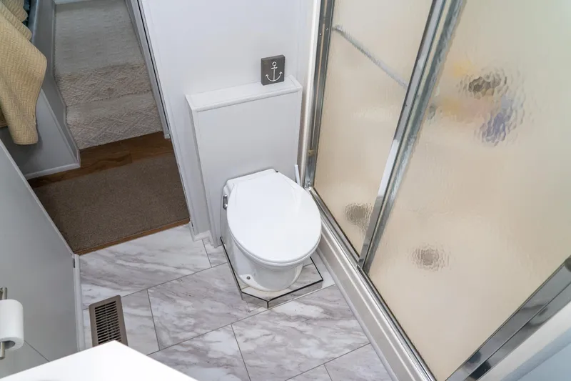 Slide: The Image of Bathroom interior of 1996 Lakeview houseboat with shower and toilet. - 60