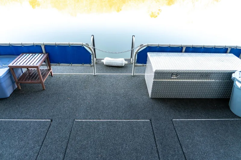 Slide: The Image of Rear deck of 1996 Lakeview 66 x 16 Widebody Houseboat with storage and seating. - 68