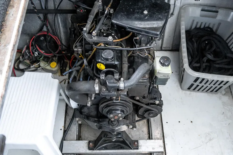 Slide: The Image of Engine compartment of a 1996 Lakeview 66 x 16 Widebody Houseboat, showing mechanical components. - 72