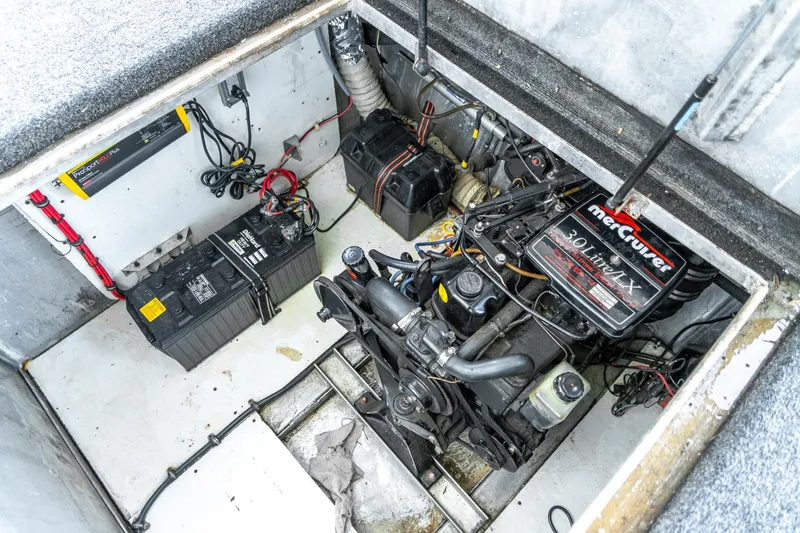 Slide: The Image of Engine compartment of a 1996 Lakeview 66 x 16 Widebody Houseboat with MerCruiser 3.0L engine. - 75