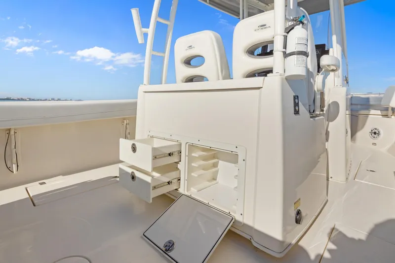 Slide: The Image of 2023 Cobia 301 Center Console boat interior with storage compartments and seating. - 20