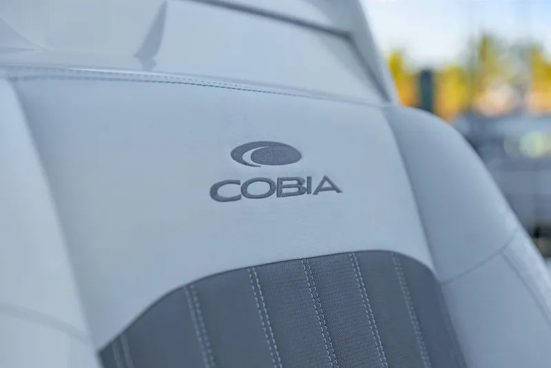 Slide: The Image of 2023 Cobia 301 Center Console seat with embroidered logo detail. - 22