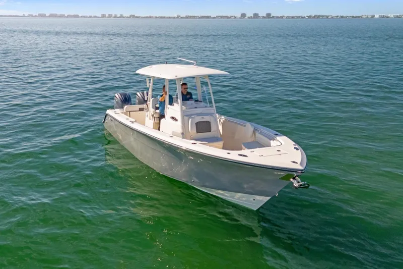 Slide: The Image of 2023 Cobia 301 Center Console on open water. - 5