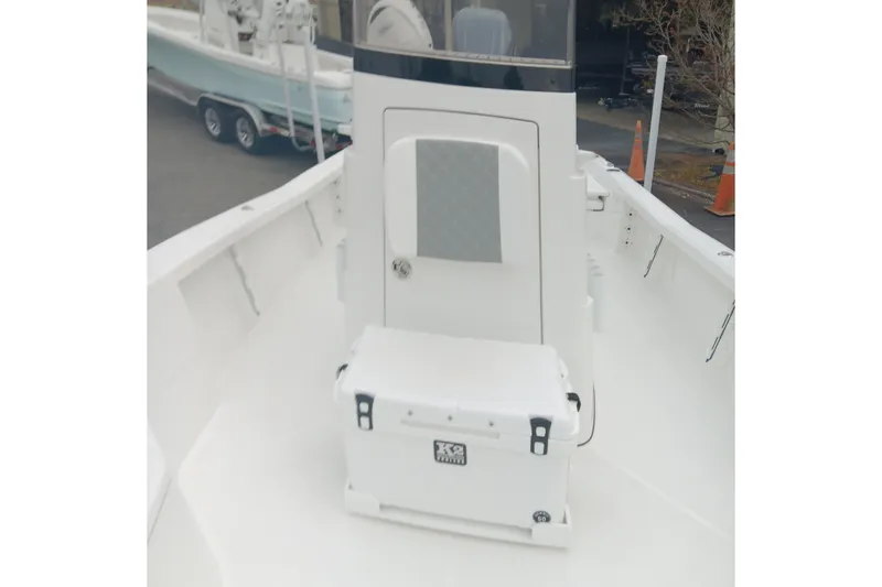 Slide: The Image of 2026 BlackJack 256 Bay boat interior with storage compartment and cooler. - 11
