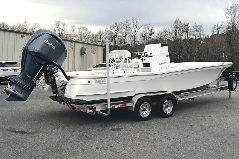 Slide: The Image of 2026 BlackJack 256 Bay boat on trailer with Yamaha outboard motor. - 2