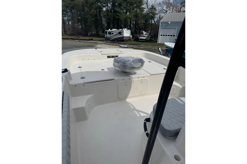 Slide: The Image of 2026 Carolina Skiff 21 LS boat interior with seating and storage compartments. - 4