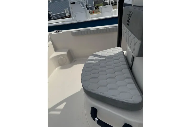 Slide: The Image of 2026 Carolina Skiff 21 LS boat interior with hexagonal-patterned seating. - 5