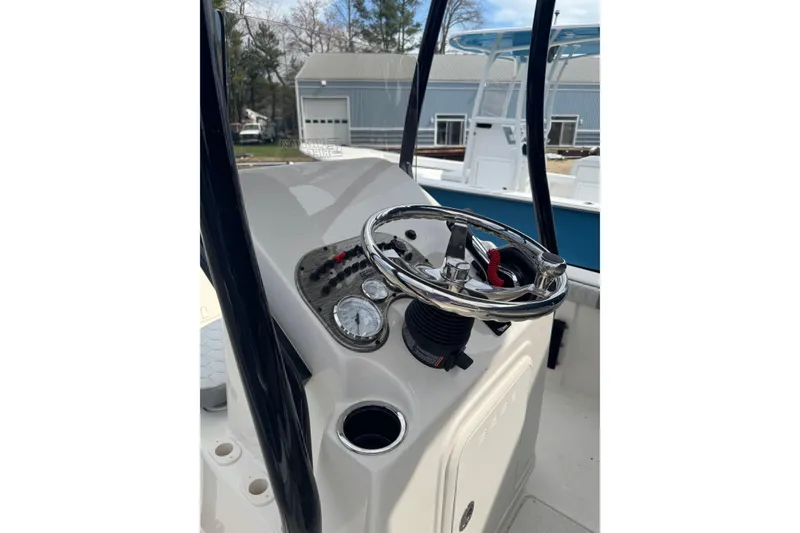 Slide: The Image of 2026 Carolina Skiff 21 LS boat console with steering wheel and gauges. - 6