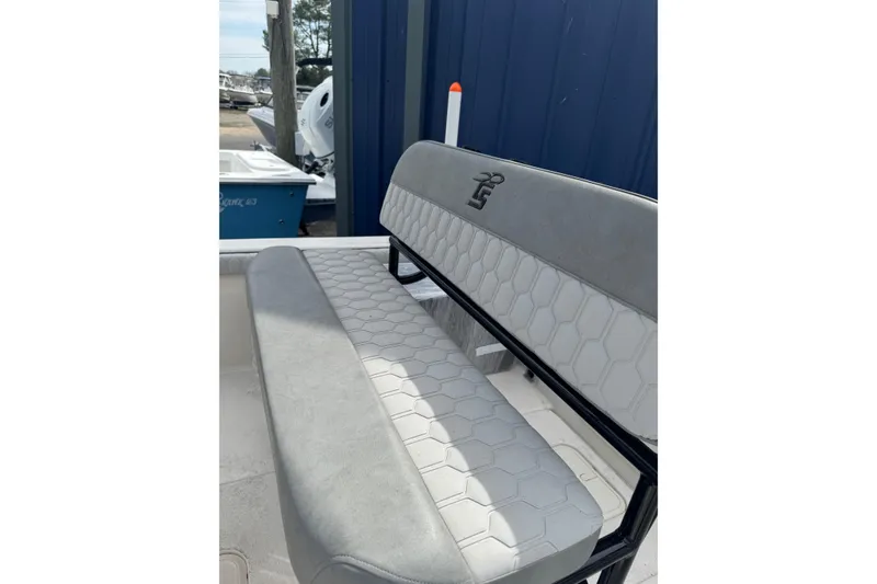 Slide: The Image of 2026 Carolina Skiff 21 LS boat seat with hexagonal pattern and LS logo. - 7