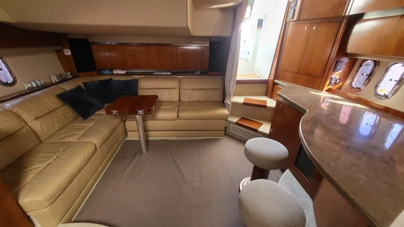Slide: The Image of Luxurious interior of 2008 Cruisers 420 Express yacht with leather seating and wooden accents. - 13