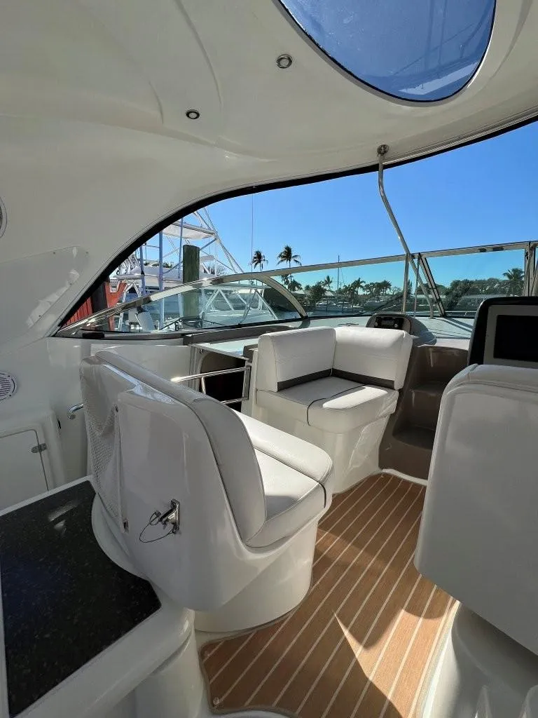 Slide: The Image of 2008 Cruisers 420 Express yacht interior with seating and wood flooring. - 6