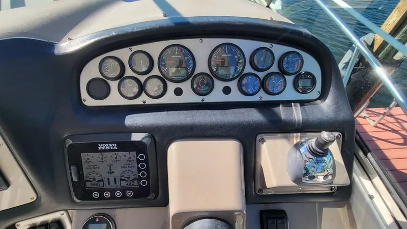 Slide: The Image of Dashboard of a 2008 Cruisers 420 Express boat with gauges and controls. - 9