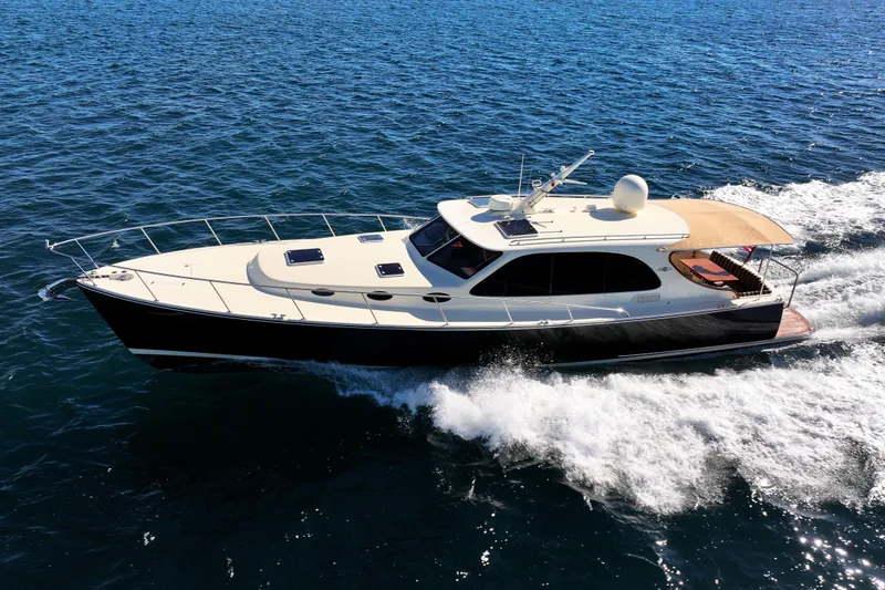 Slide: The Image of 2015 Palm Beach Motor Yachts PB45 cruising on open water. - 17