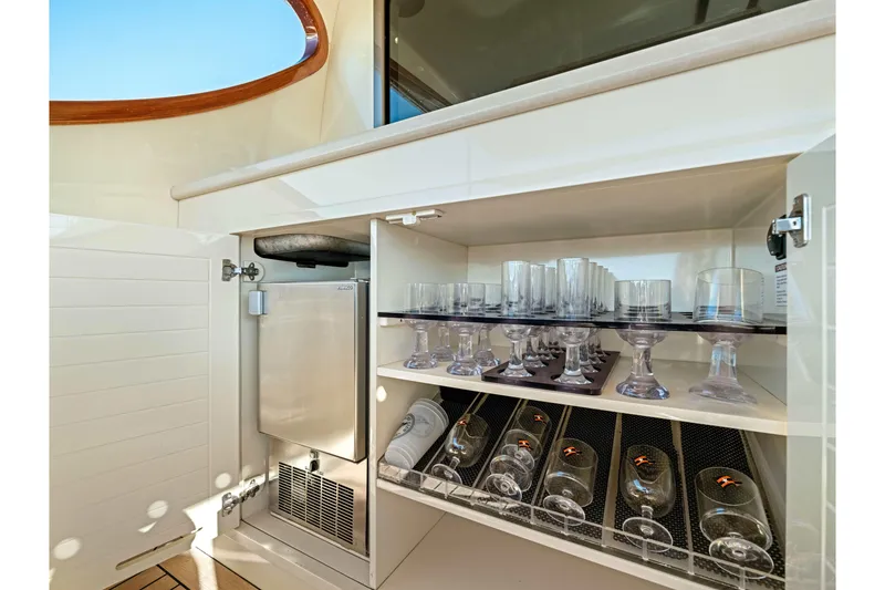 Slide: The Image of Luxury yacht PB45 interior with glassware storage and mini fridge, Palm Beach Motor Yachts 2015. - 33