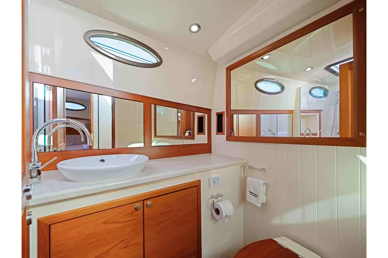 Slide: The Image of Luxurious bathroom interior of 2015 Palm Beach Motor Yachts PB45 with elegant wood accents. - 50