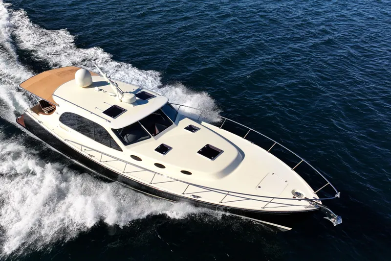 Slide: The Image of 2015 Palm Beach Motor Yachts PB45 cruising on open water. - 13