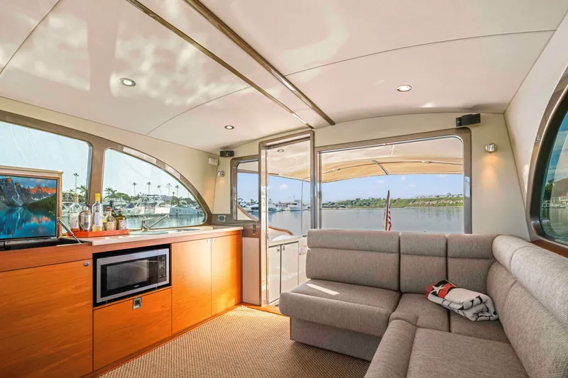 Slide: The Image of Luxurious interior of 2015 Palm Beach Motor Yachts PB45 with scenic marina view. - 35