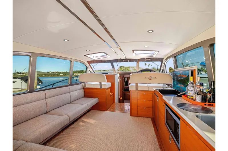 Slide: The Image of Luxurious interior of 2015 Palm Beach Motor Yachts PB45 with elegant seating and modern amenities. - 38