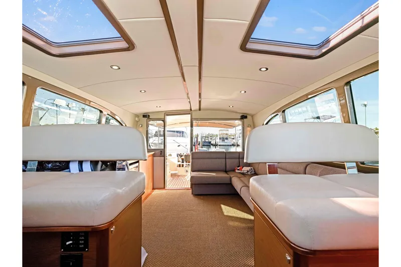 Slide: The Image of Luxurious interior of 2015 Palm Beach Motor Yachts PB45 with skylights and plush seating. - 40