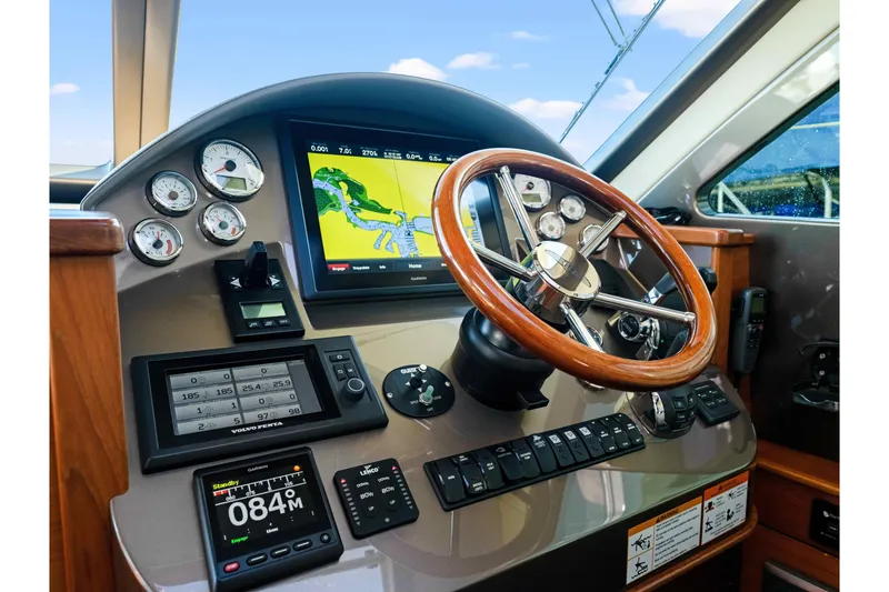 Slide: The Image of Cockpit of 2015 Palm Beach Motor Yachts PB45 with navigation and control instruments. - 45