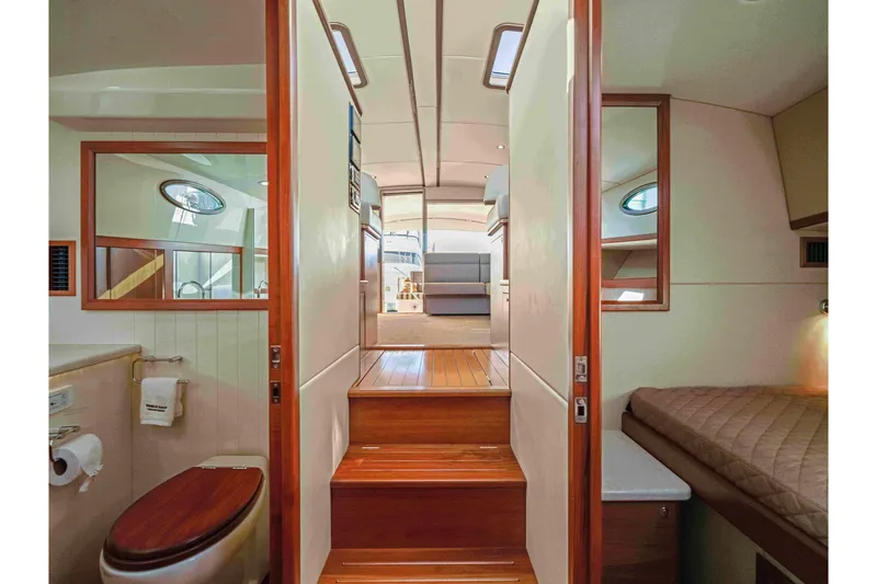 Slide: The Image of Luxurious interior of 2015 Palm Beach Motor Yachts PB45, featuring wood accents and cozy cabin. - 47