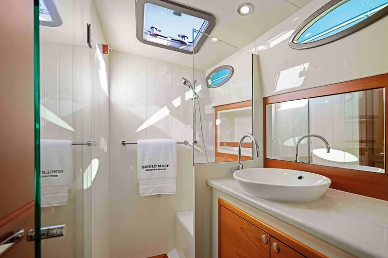 Slide: The Image of Luxurious bathroom interior of 2015 Palm Beach Motor Yachts PB45, featuring modern fixtures and elegant design. - 51