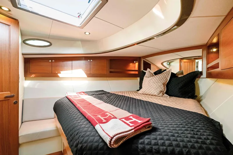 Slide: The Image of Luxurious cabin interior of 2015 Palm Beach Motor Yachts PB45 with elegant bedding. - 55