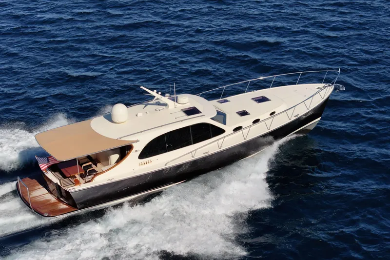 Slide: The Image of 2015 Palm Beach Motor Yachts PB45 cruising on open water, showcasing sleek design and elegance. - 8
