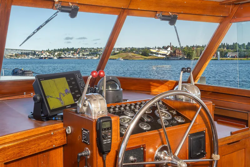 Slide: The Image of Interior view of a 1965 Stephens Flushdeck boat with steering wheel and navigation system. - 19