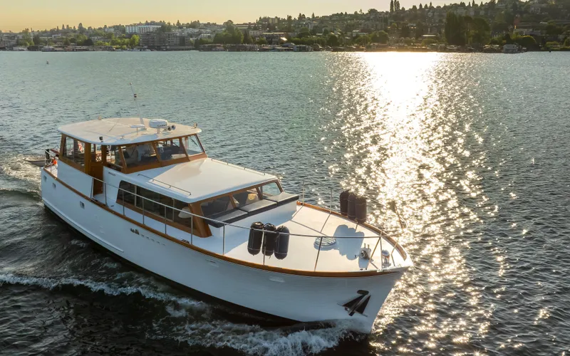 Slide: The Image of 1965 Stephens Flushdeck yacht cruising on sunny waters. - 3