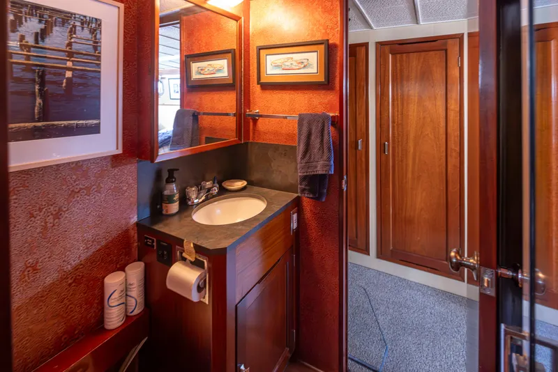 Slide: The Image of Interior of a 1965 Stephens Flushdeck yacht featuring a bathroom. - 30