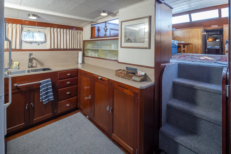 Slide: The Image of Interior of a 1965 Stephens Flushdeck yacht with wooden cabinetry. - 31